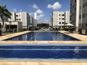 a large swimming pool in the middle of a building at RESIDENCIAL ALAMEDA JARDINS in Aracaju