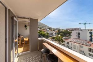 a balcony with a view of a city at Greenpoint Emerald in Cape Town