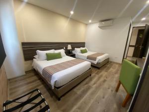 Postelja oz. postelje v sobi nastanitve EcoHub Hotel Medellin