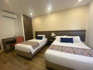 Postelja oz. postelje v sobi nastanitve EcoHub Hotel Medellin