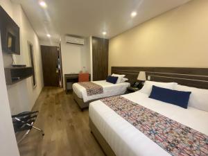 Postelja oz. postelje v sobi nastanitve EcoHub Hotel Medellin