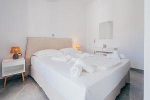 Postel nebo postele na pokoji v ubytování Orion Suite & Apartments