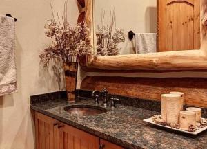 a bathroom counter with a sink and a mirror at Big Timber Lodge by Ski Country Resorts in Breckenridge +20 photos