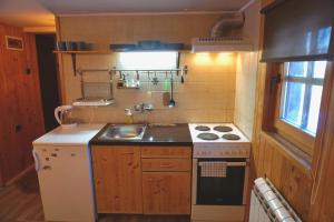 Kuchyň nebo kuchyňský kout v ubytování Guest House Montana