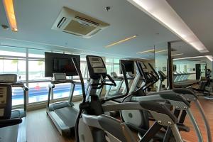 a gym with a bunch of cardio machines at Hotel Brisas do Lago Brasília - Ozped Flats in Brasilia