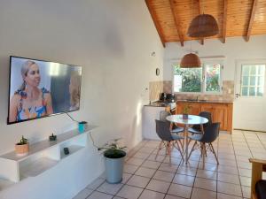 a living room with a tv on a wall at Ventanas de la Patagonia 3 in Esquel