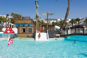 a group of children playing in the water at a water park at H10 Suites Lanzarote Gardens in Costa Teguise