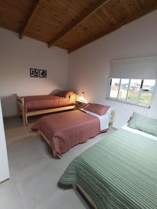 Säng eller sängar i ett rum på Casa vacacional LUNA DE MAR