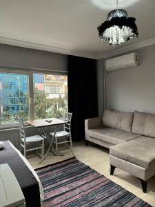 a living room with a couch and a table at FORYOU SUİT OTEL in Istanbul