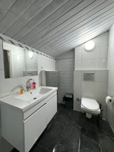a bathroom with a sink and a toilet at FORYOU SUİT OTEL in Istanbul