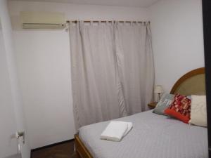 Ένα ή περισσότερα κρεβάτια σε δωμάτιο στο Punto ideal