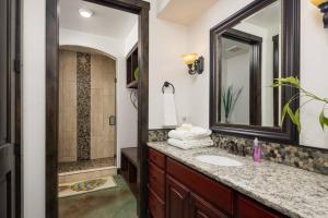 a bathroom with a sink and a mirror at Luxury Downtown Rental (Hot Tub/Pet Friendly) - La Dolce Vita Villas #10 in Moab