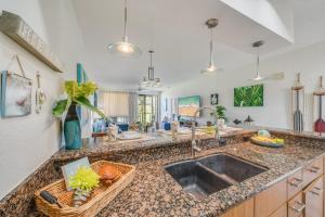 a kitchen with a sink and a counter top at Grand Champions 163 in Wailea