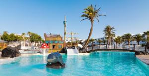 a water park with a dolphin in the water at H10 Suites Lanzarote Gardens in Costa Teguise
