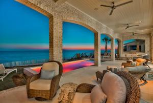 a living room with a view of the ocean at 408 Blue Mountain in Santa Rosa Beach