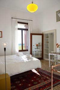 Ένα ή περισσότερα κρεβάτια σε δωμάτιο στο B&B Giardino Jappelli (Villa Ca' Minotto)