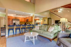 a living room with a couch and a table at Kihei Resort 202 · KRS 202 Family Getaway 2BD w AC Pool Beach in Kihei