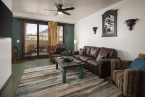 a living room with a couch and a table at Luxury Downtown Rental (Hot Tub/Pet Friendly) - La Dolce Vita Villas #11 in Moab