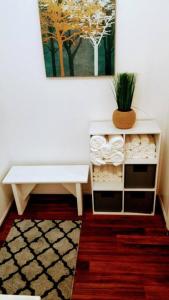 a white table in a room with a plant on it at River Retreat Cabin in Three Rivers - near SNP in Three Rivers