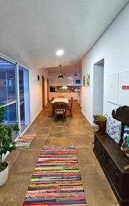 a living room with a table and a couch at Casa da Abelheira in Ponta Delgada