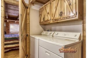 a laundry room with a washer and dryer at Mountain Memories Is A Perfect Mountain Getaway For A Family Or Couples Retreat! in Sevierville +27 photos