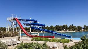 a water slide at a water park with chairs at Apartment Karla 4 in Supetar