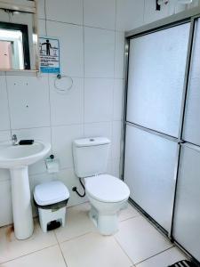 a bathroom with a toilet and a sink and a shower at Man's Place Hostel Masculino in Porto Alegre