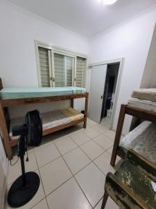 a room with two bunk beds and a camera at Man's Place Hostel Masculino in Porto Alegre