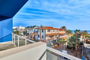 an apartment balcony with a view of a city at Atlantic Sal Design Apartments in Santa Maria