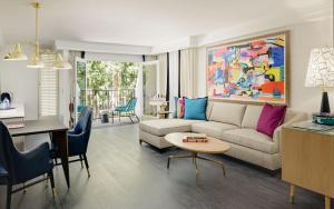 a living room with a couch and a table at Le Parc at Melrose in Los Angeles