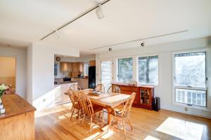 a kitchen and dining room with a table and chairs at Great Barrington Getaway Lake Access, Water Views in Great Barrington