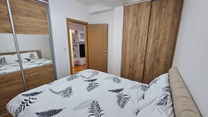 Ένα ή περισσότερα κρεβάτια σε δωμάτιο στο Apartman Dolores