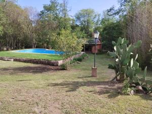 a garden with a swimming pool in the background at La Salamdra in La Granja