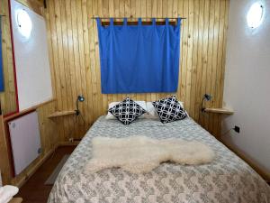 Un pat sau paturi într-o cameră la Hostal Hunter