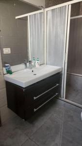 a bathroom with a sink and a shower at 3 bedroom apt excellent location near to malls in Cairo