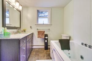 a bathroom with a tub and a sink at Charming Wilton Vacation Rental with Fire Pit in Wilton