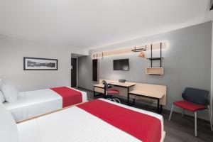 Postel nebo postele na pokoji v ubytování City Express by Marriott Silao Aeropuerto