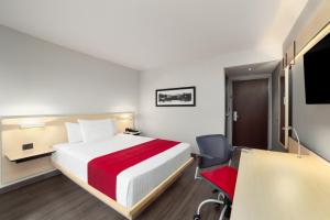 Postel nebo postele na pokoji v ubytování City Express by Marriott Silao Aeropuerto