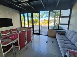 a living room with a couch and a table at Frank's Place in Yzerfontein