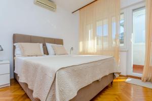 Posteľ alebo postele v izbe v ubytovaní Apartments Edita