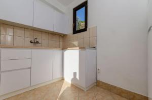 Kuchyňa alebo kuchynka v ubytovaní Apartments Edita