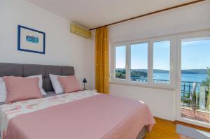 Posteľ alebo postele v izbe v ubytovaní Apartments Edita