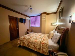 Letto o letti in una camera di Hotel Bucaneiro