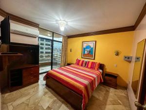 Letto o letti in una camera di Hotel Bucaneiro