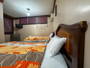 Letto o letti in una camera di Hotel Bucaneiro