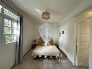 Voodi või voodid majutusasutuse Studio Rez de villa avec piscine toas