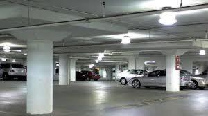 a parking garage with several cars parked in it at Apartament Bialystok in Białystok