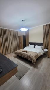 מיטה או מיטות בחדר ב-Vila Bakri Couple Room