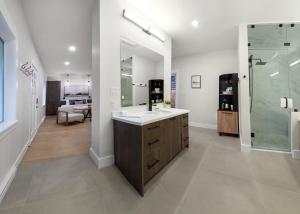 a bathroom with a sink and a glass shower at West Coast Trail Lodge in Port Renfrew