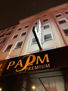 a sign for a pvdarma programme on a building at Palm Premium Hotel & Apartments in Düsseldorf